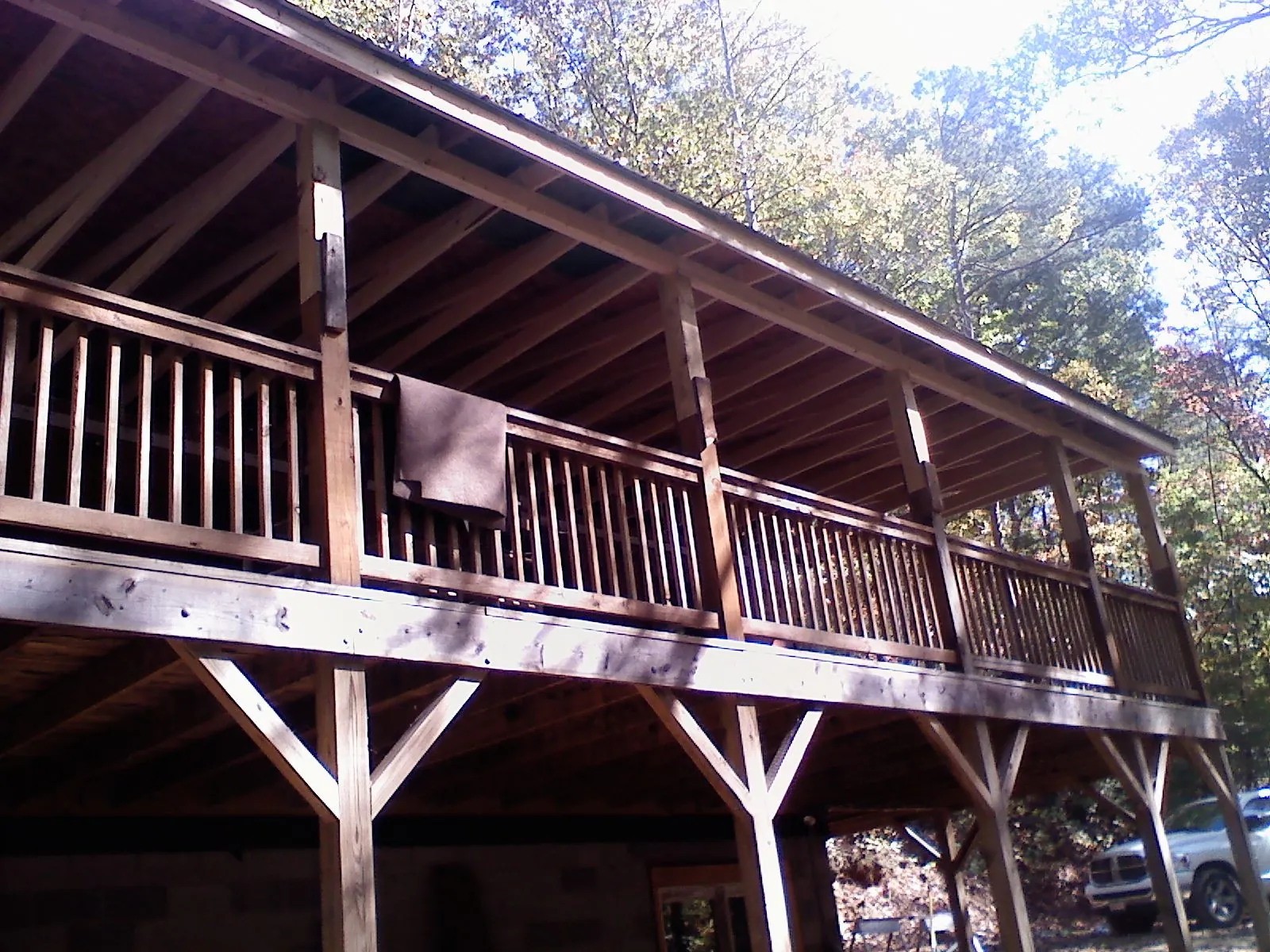Timber framing under a new elevated porch and deck — Roof Leak Repair in China by Roofing Brothers